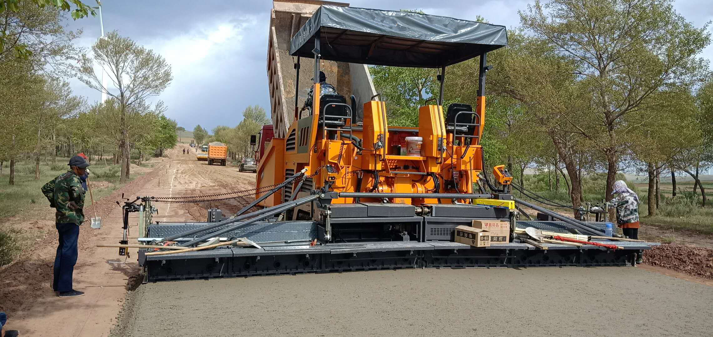 concrete paving machine is working